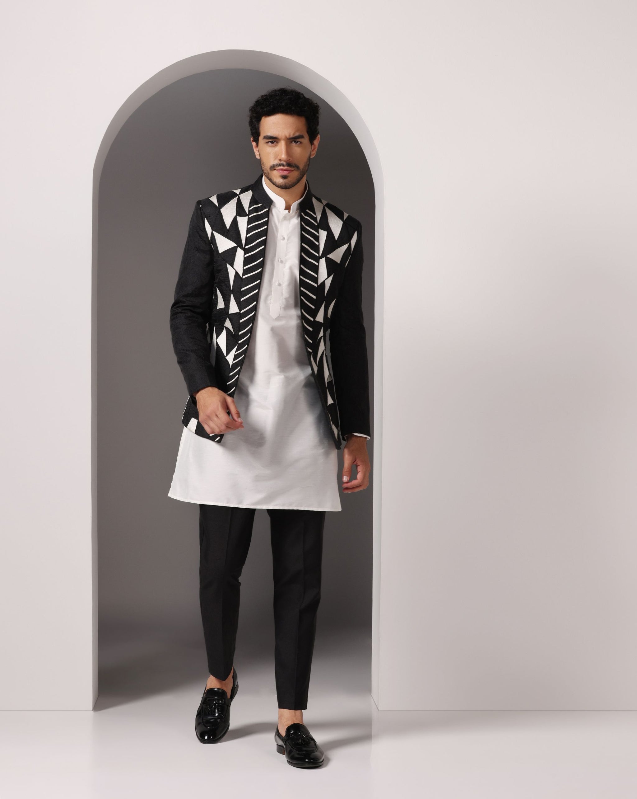 Monochrome Chic: Black Jacket with Thread Embroidery, White Kurta, and
