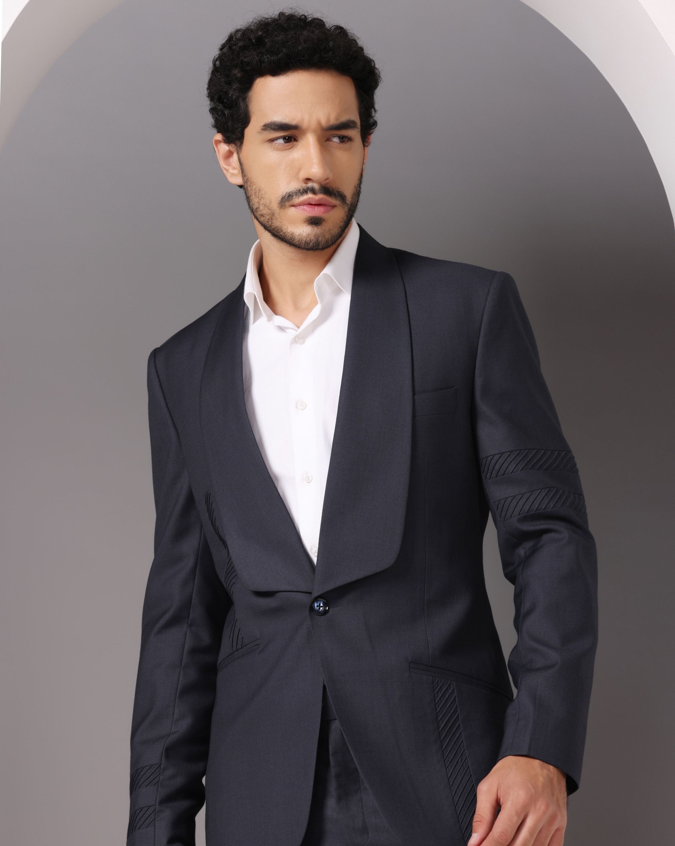Sapphire Sophistication: Dark Grey Suit with Pintuck Detailing and Tux Lapel