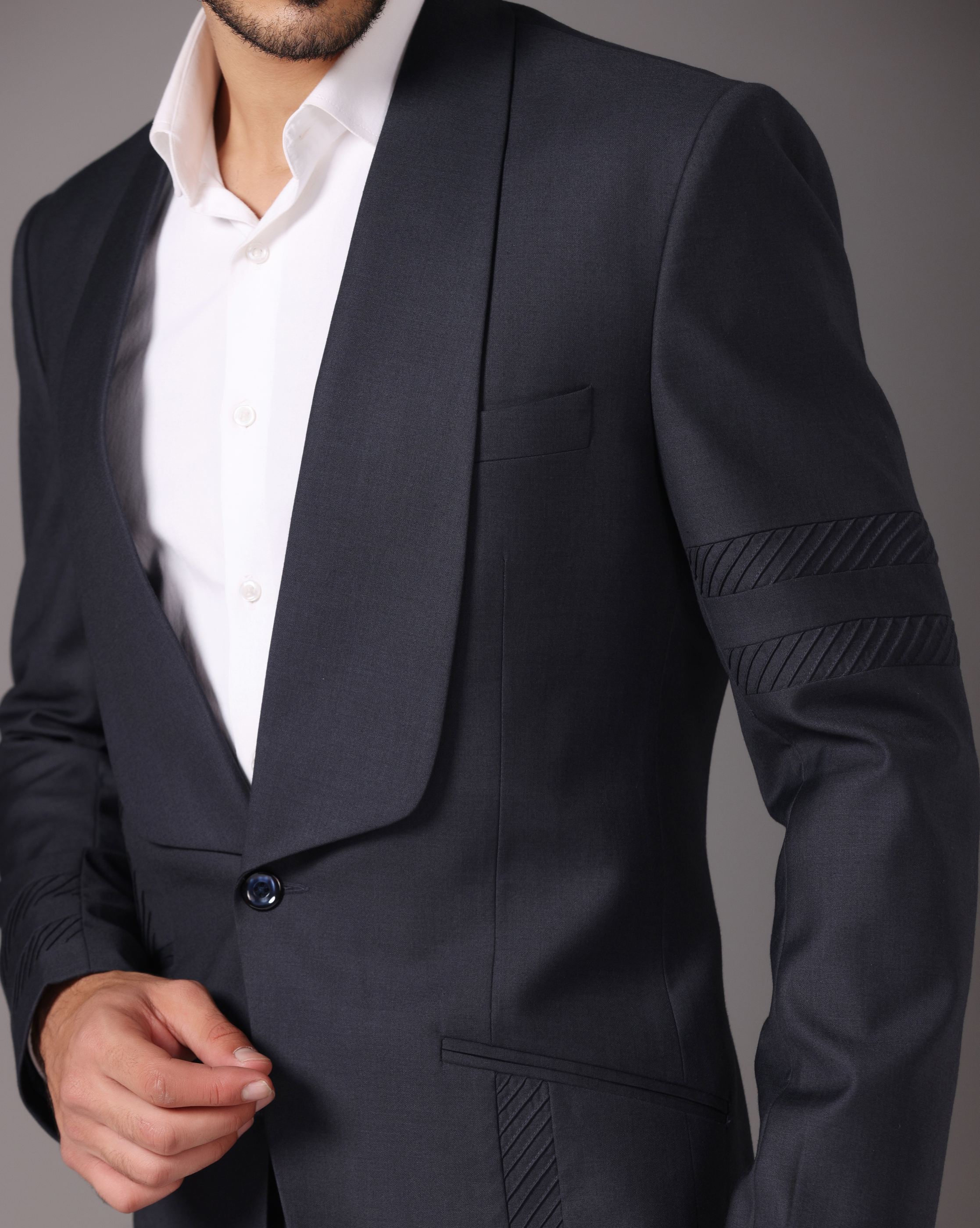 Sapphire Sophistication: Dark Grey Suit with Pintuck Detailing and Tux Lapel