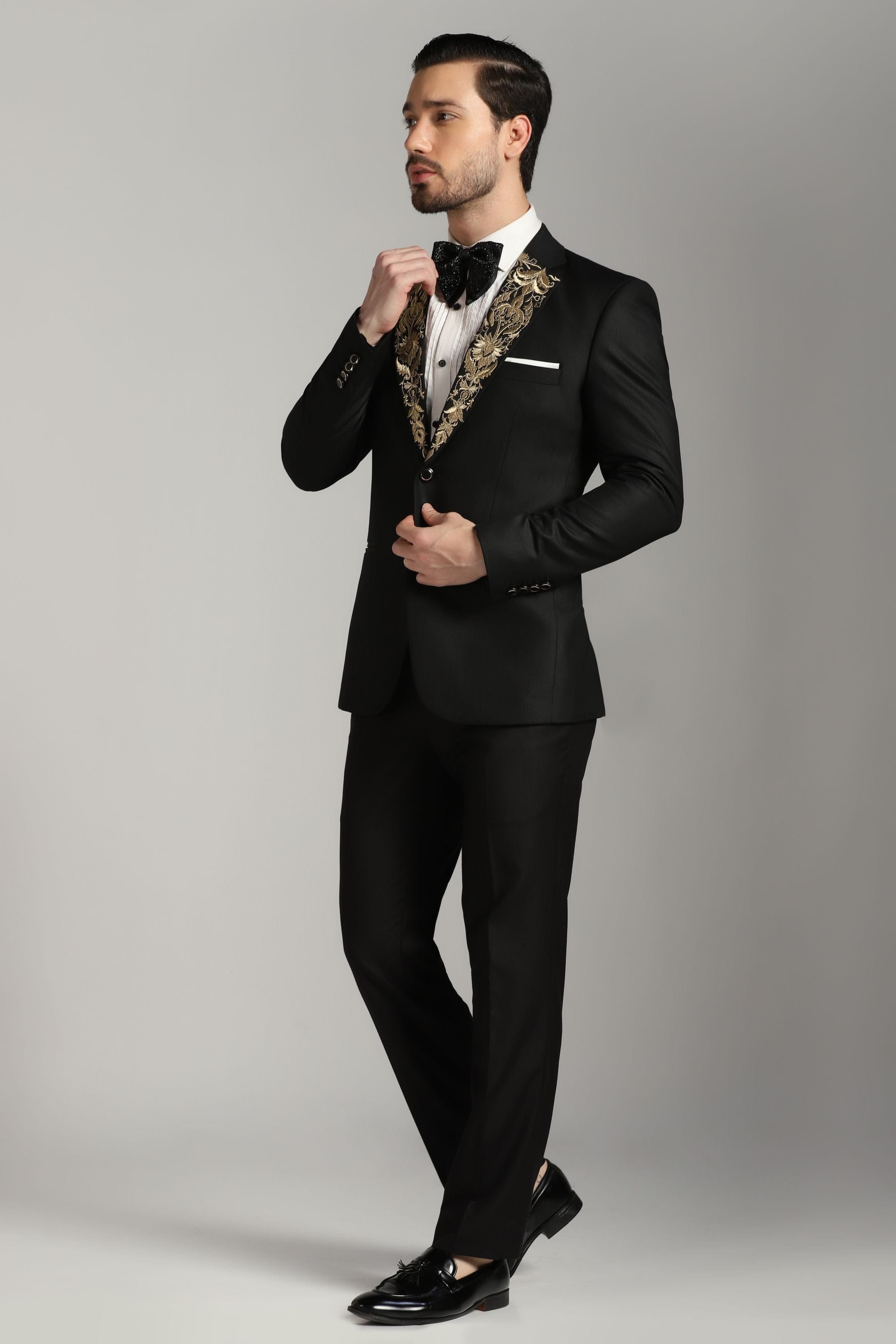 Dapper Black Tuxedo: Your Timeless Statement with a Touch of Gold