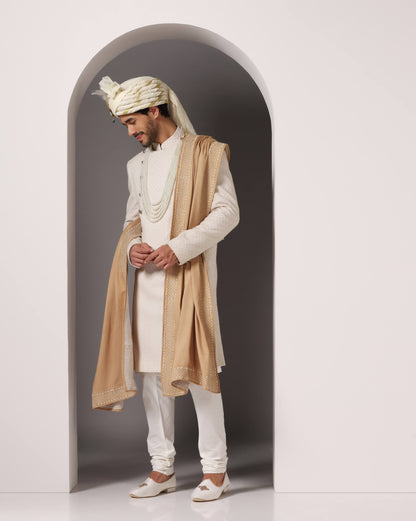 Ivory C-cut sherwani with Zari embroidery three-quarter view | Bhavya Bhasin Couture
