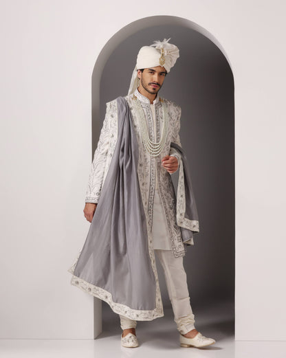 Ivory hand and machine embroidered sherwani three-quarter view | Bhavya Bhasin Couture