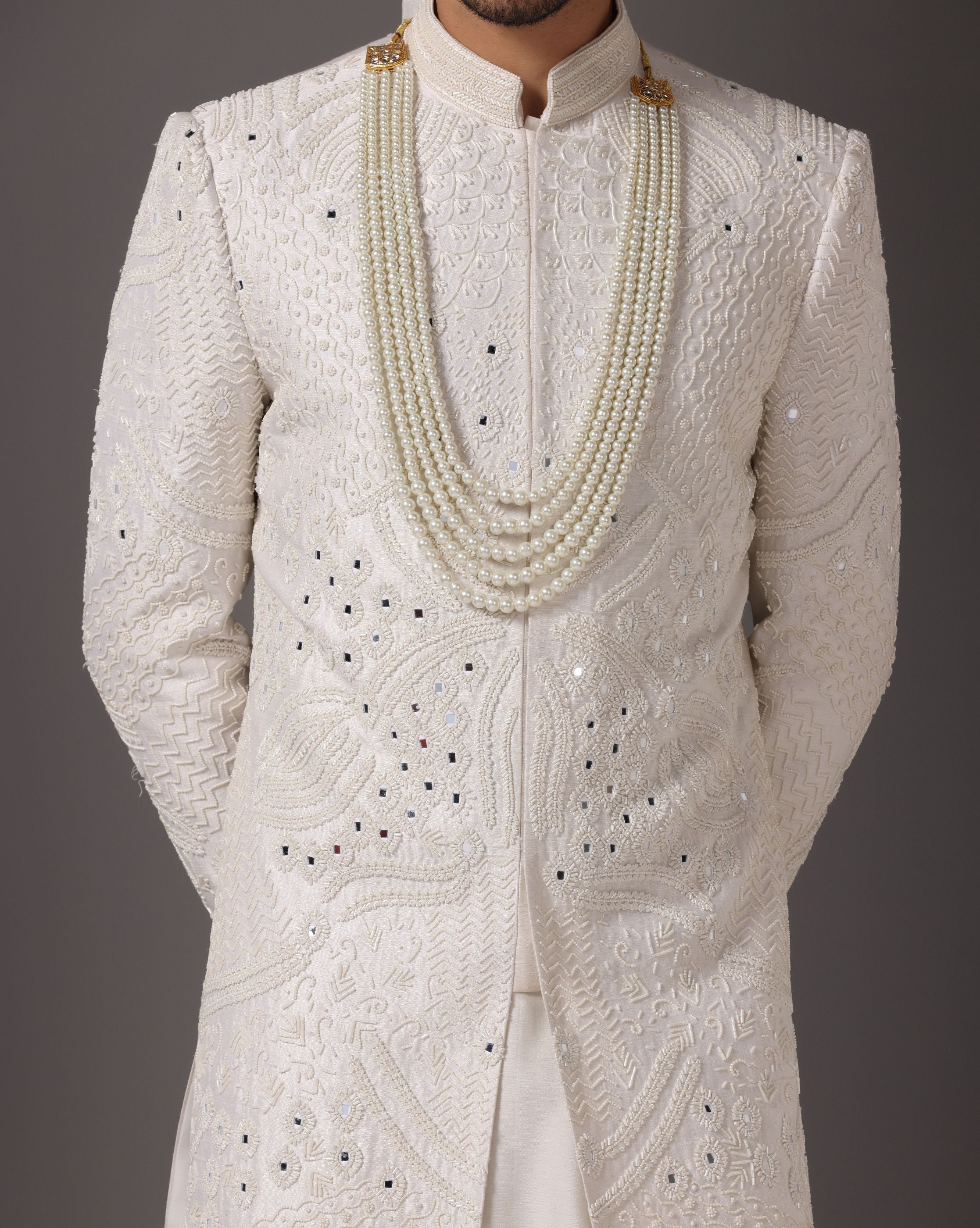 Ivory Opulence: Sherwani with Exquisite Hand Embroidery, Cutdaana, and Pearls