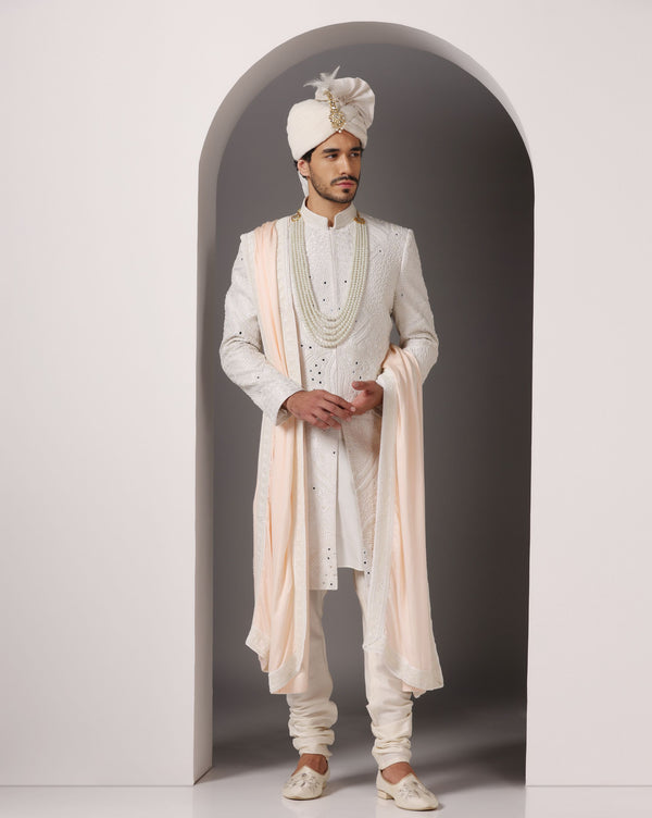 Ivory Opulence: Sherwani with Exquisite Hand Embroidery, Cutdaana, and Pearls