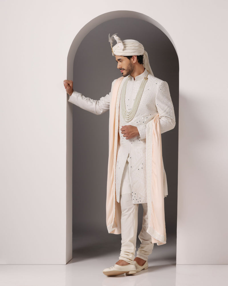 Ivory Opulence: Sherwani with Exquisite Hand Embroidery, Cutdaana, and Pearls