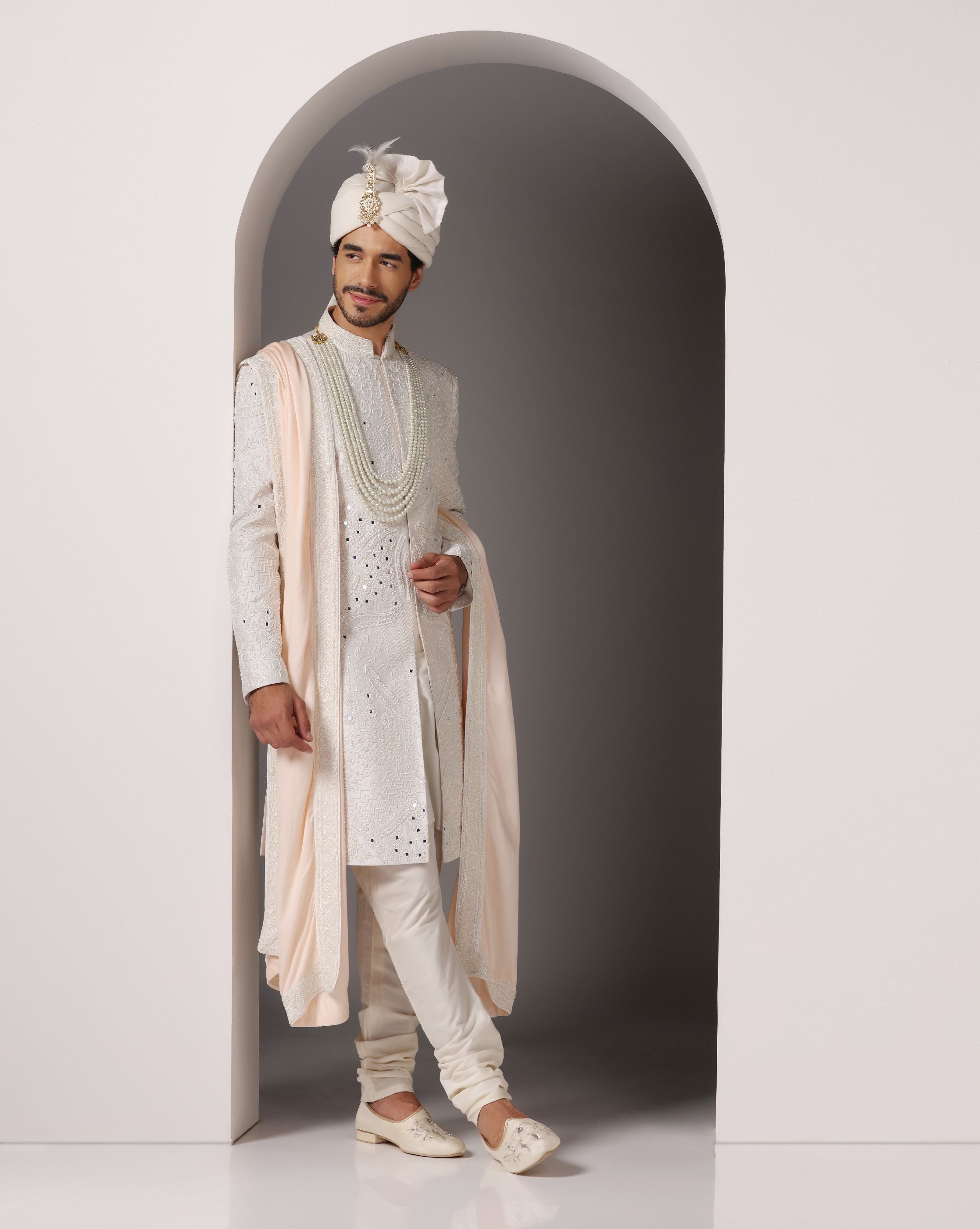 Ivory Opulence: Sherwani with Exquisite Hand Embroidery, Cutdaana, and Pearls