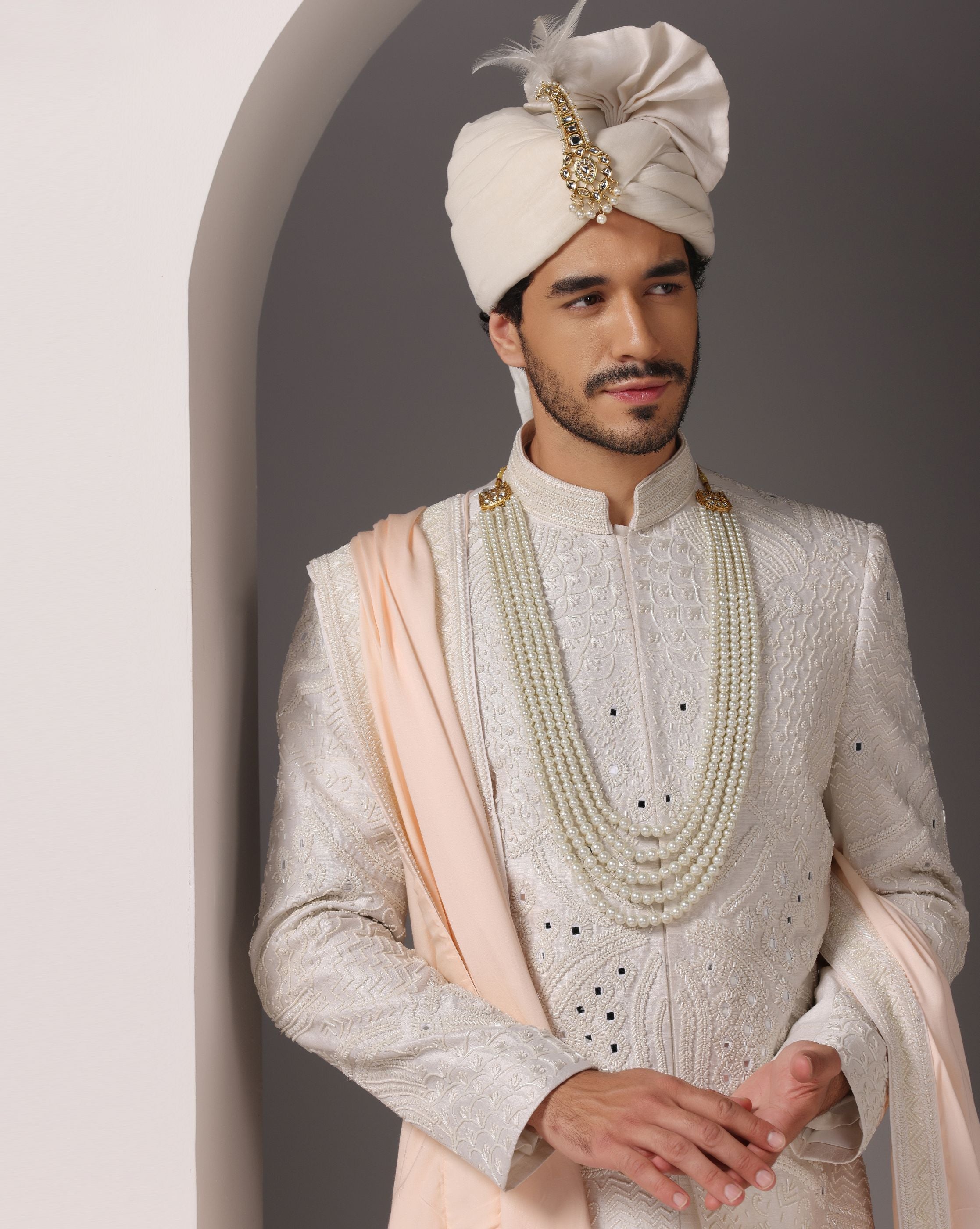 Ivory Opulence: Sherwani with Exquisite Hand Embroidery, Cutdaana, and Pearls