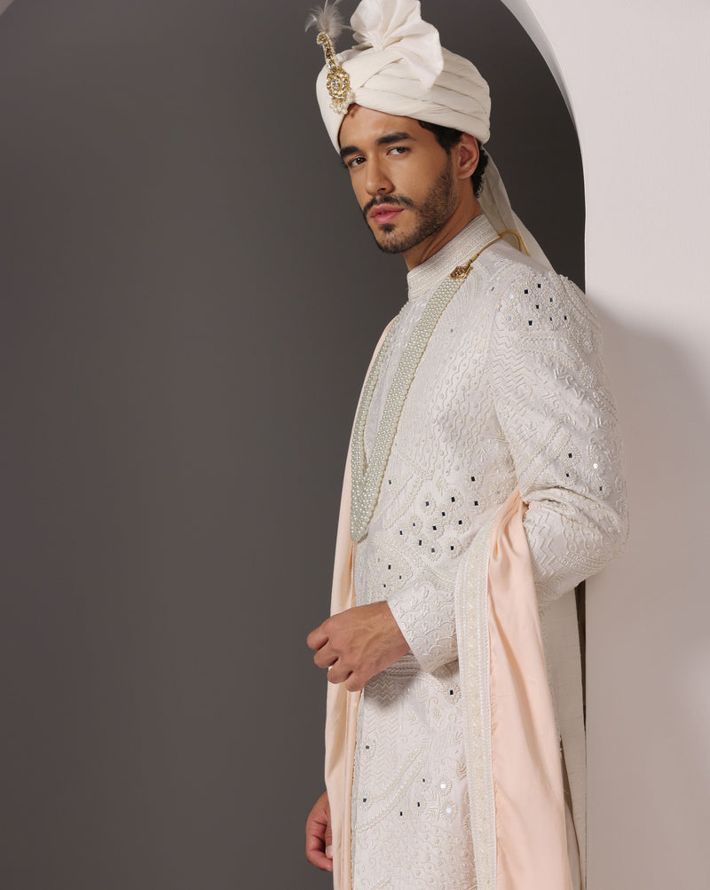 Ivory Opulence: Sherwani with Exquisite Hand Embroidery, Cutdaana, and Pearls
