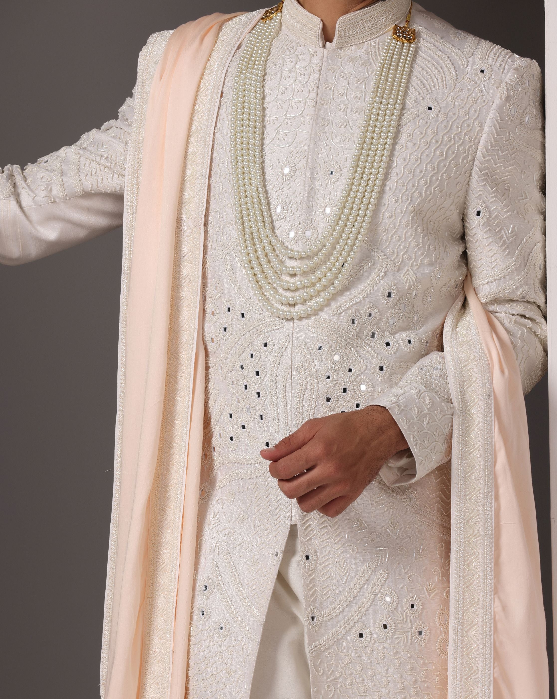 Ivory Opulence: Sherwani with Exquisite Hand Embroidery, Cutdaana, and Pearls