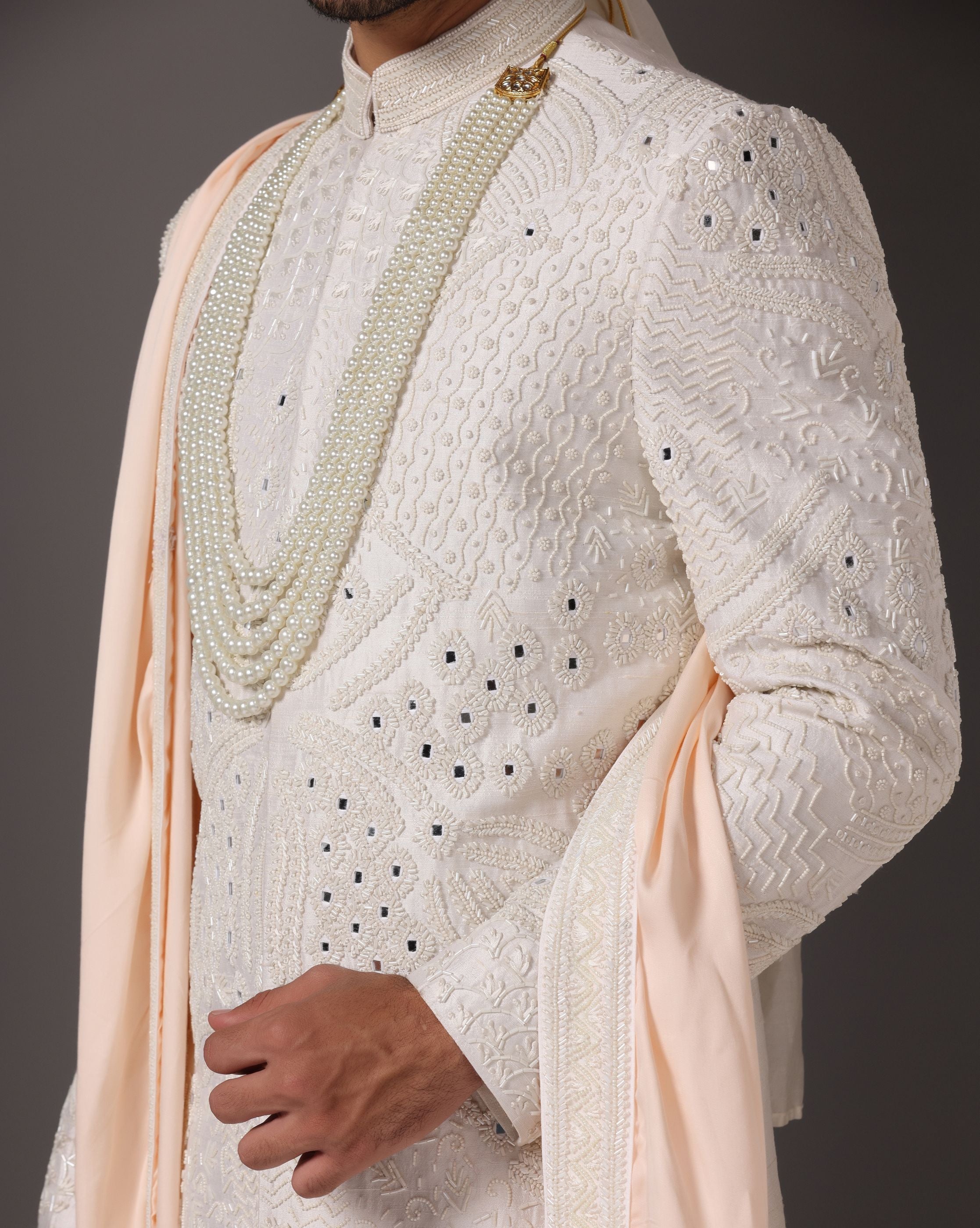 Ivory Opulence: Sherwani with Exquisite Hand Embroidery, Cutdaana, and Pearls