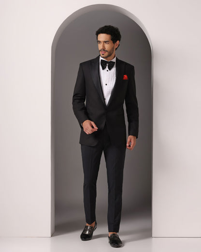 Black single button peak lapel classic tuxedo | Bhavya Bhasin Couture