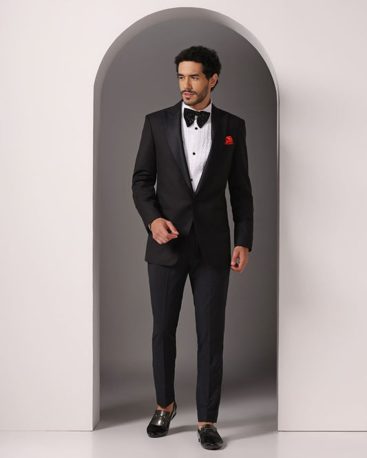 Black single button peak lapel classic tuxedo | Bhavya Bhasin Couture