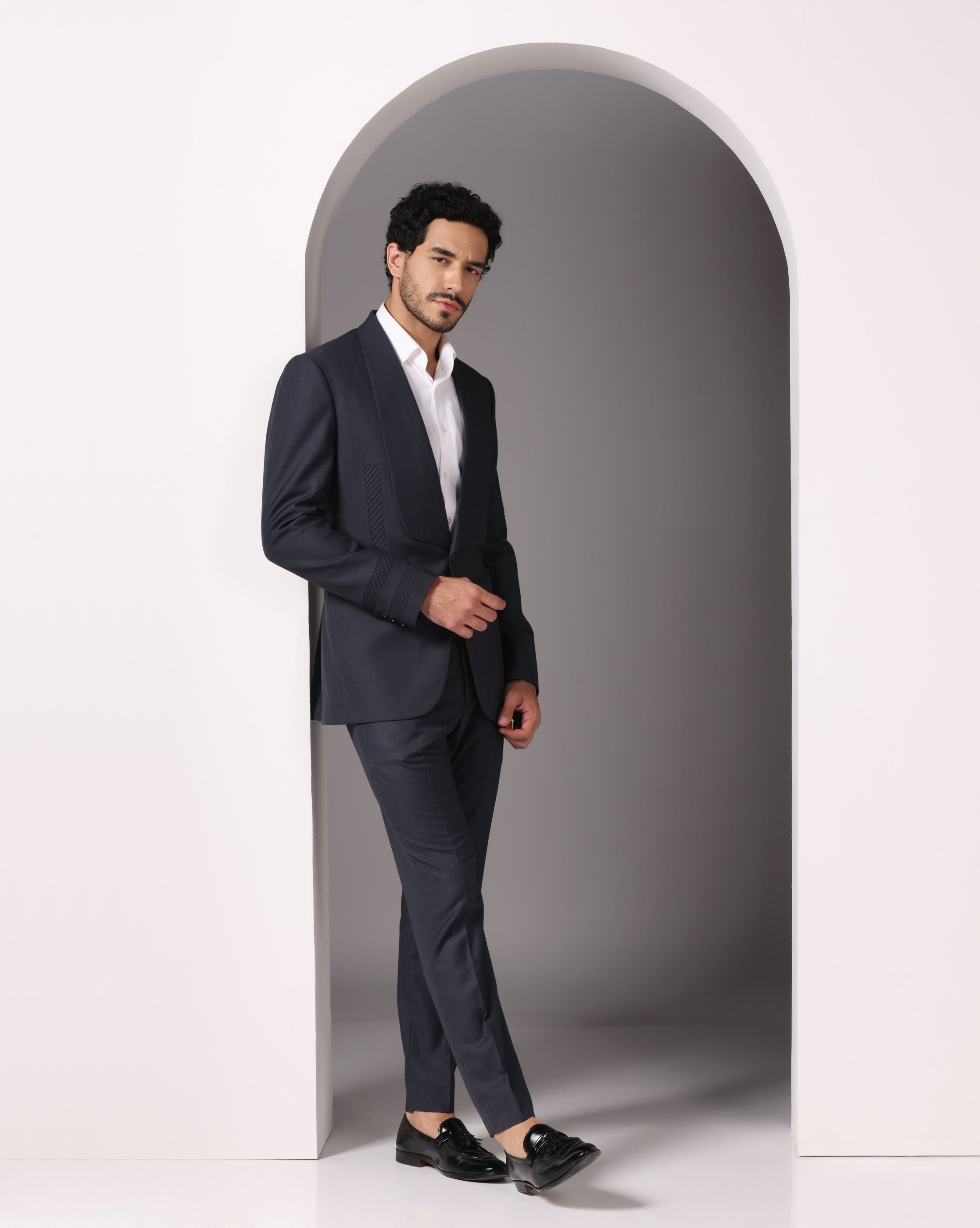 Sapphire Sophistication: Dark Grey Suit with Pintuck Detailing and Tux Lapel