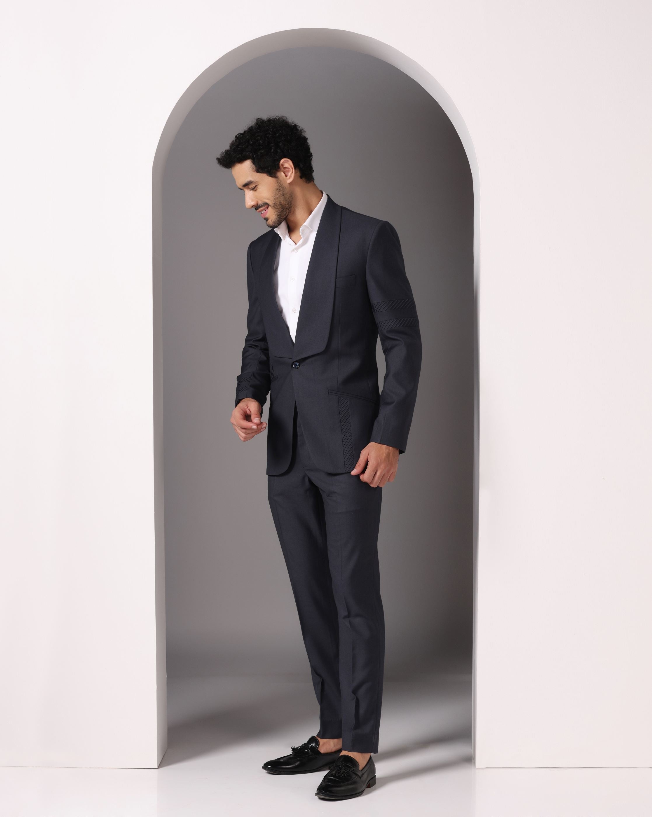 Sapphire Sophistication: Dark Grey Suit with Pintuck Detailing and Tux Lapel