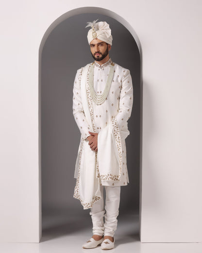 Ivory sherwani with antique gold hand embroidery | Bhavya Bhasin Couture