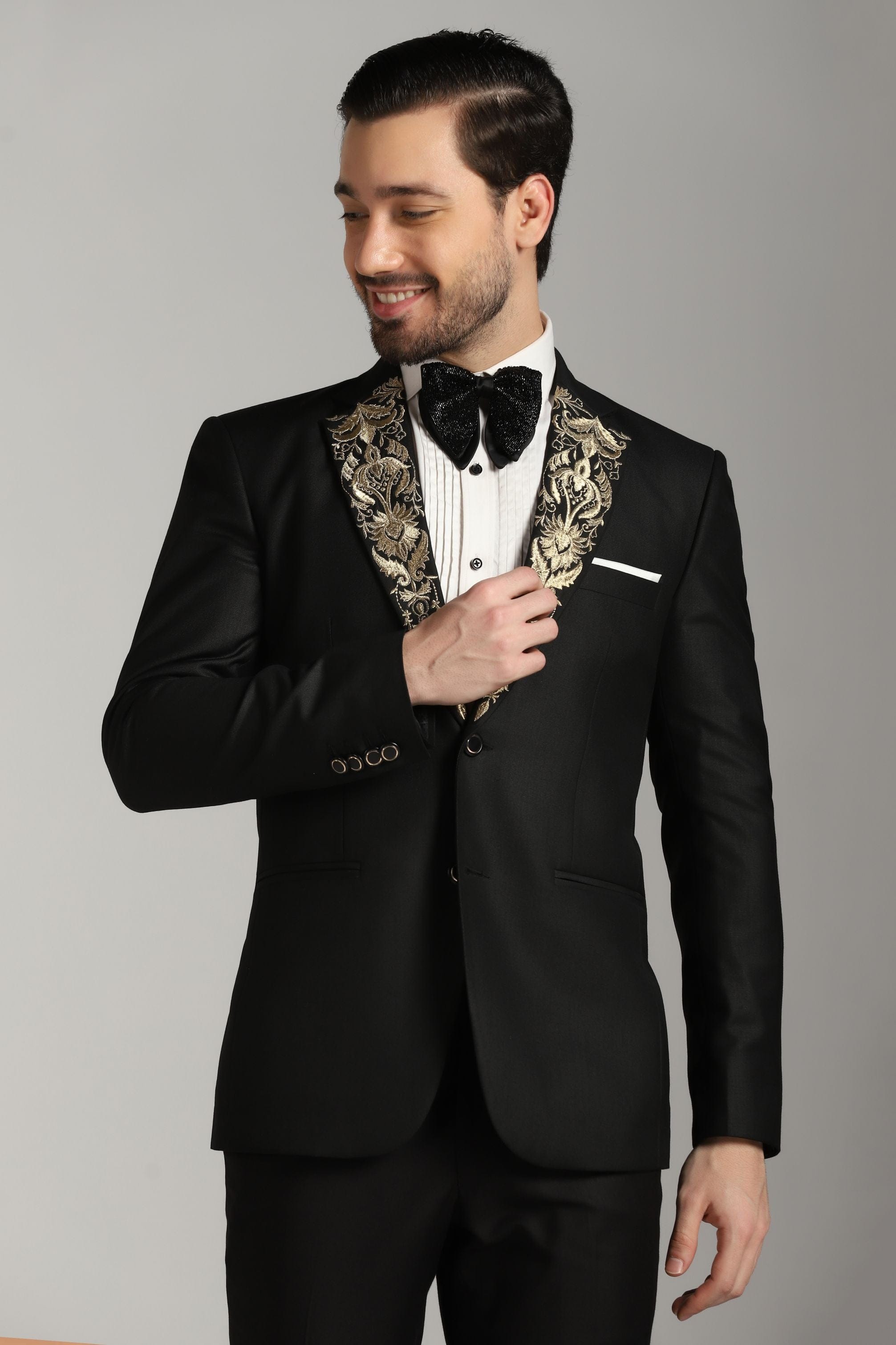 Dapper Black Tuxedo: Your Timeless Statement with a Touch of Gold