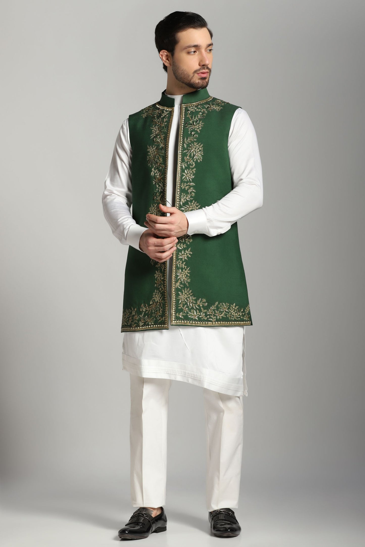 Emerald green long Nehru jacket with ivory asymmetric kurta | Bhavya Bhasin Couture